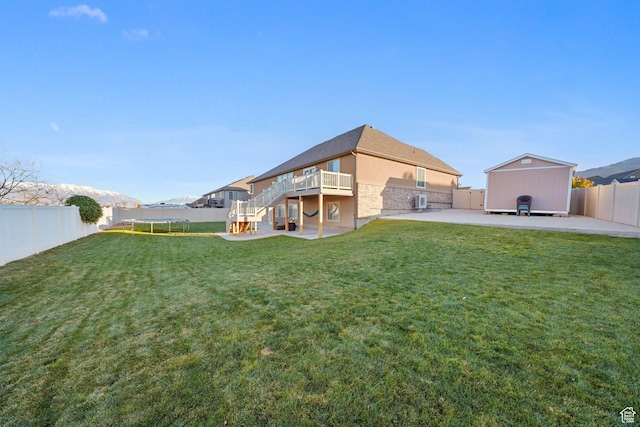 758 W Cedar View Dr, Saratoga Springs, UT 84045 - back of property with a fenced backyard, stairway, a patio area, a wooden deck, and stone siding