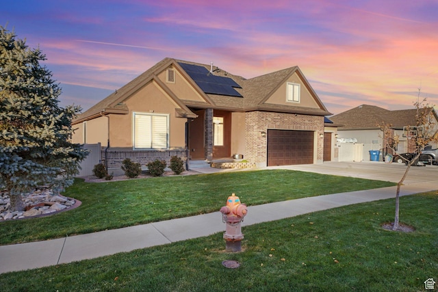 758 W Cedar View Dr, Saratoga Springs, UT 84045 - view of front of house with roof mounted solar panels, stucco siding, concrete driveway, and brick siding