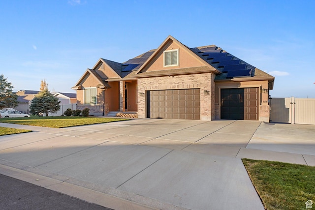 758 W Cedar View Dr, Saratoga Springs, UT 84045 - view of front of property with a gate, roof mounted solar panels, an attached garage, and driveway