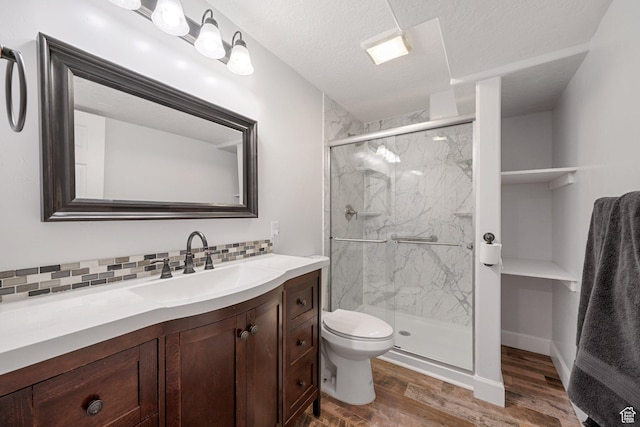 758 W Cedar View Dr, Saratoga Springs, UT 84045 - bathroom with wood finished floors, vanity, a marble finish shower, and decorative backsplash