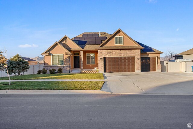 758 W Cedar View Dr, Saratoga Springs, UT 84045 - craftsman inspired home featuring solar panels, concrete driveway, a gate, a garage, and brick siding