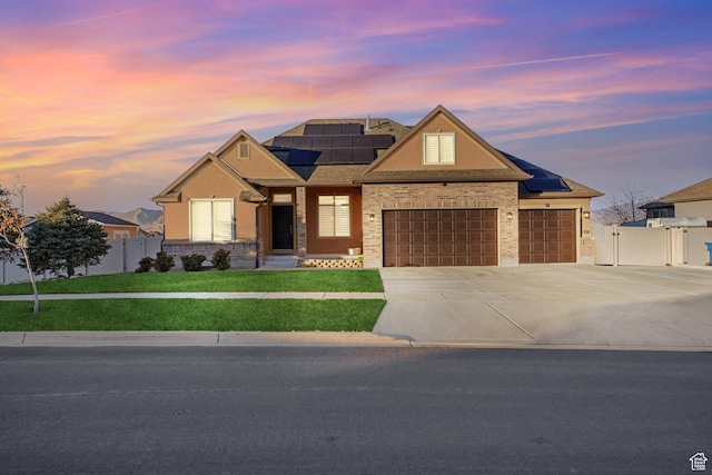 758 W Cedar View Dr, Saratoga Springs, UT 84045 - view of front of house featuring solar panels, concrete driveway, an attached garage, a gate, and stucco siding