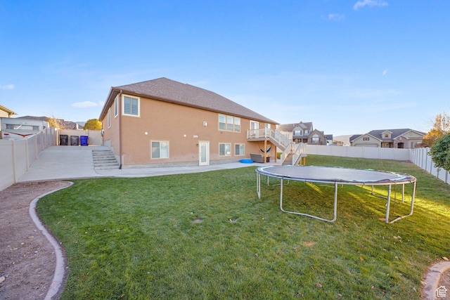 758 W Cedar View Dr, Saratoga Springs, UT 84045 - fenced backyard featuring stairway, a trampoline, and a patio area