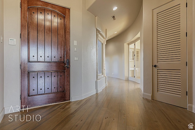 entrance foyer with hardwood / wood-style flooring and a mail area