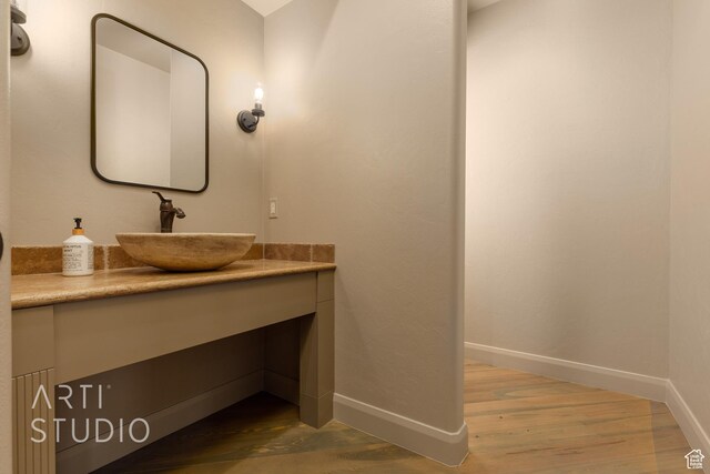 bathroom featuring vanity and hardwood / wood-style floors