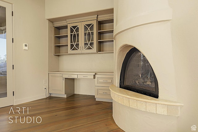interior space featuring hardwood / wood-style flooring and built in desk