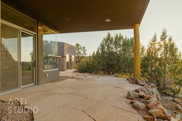 view of patio terrace at dusk