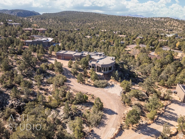 birds eye view of property with a mountain view