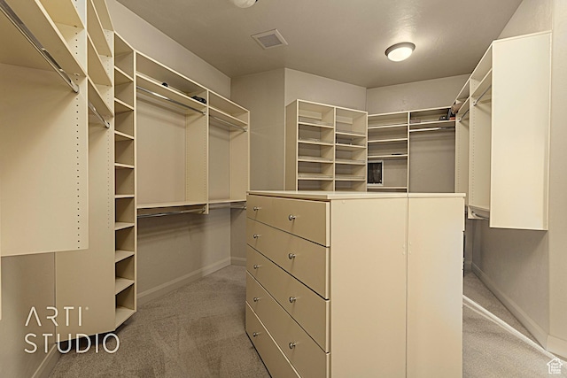 walk in closet featuring carpet floors