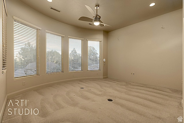 carpeted empty room with ceiling fan
