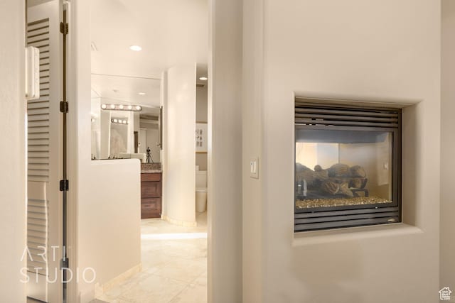 hallway with light tile patterned flooring