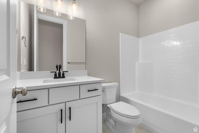 full bathroom featuring shower / bathing tub combination, vanity, and toilet