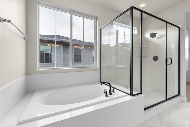 bathroom with shower with separate bathtub