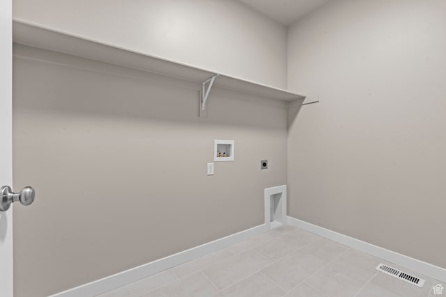 2616 N 3020 W, Clinton, UT 84015 - laundry room featuring hookup for an electric dryer, hookup for a washing machine, and light tile patterned floors