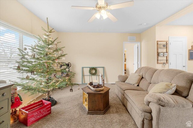 living room with ceiling fan and light colored carpet