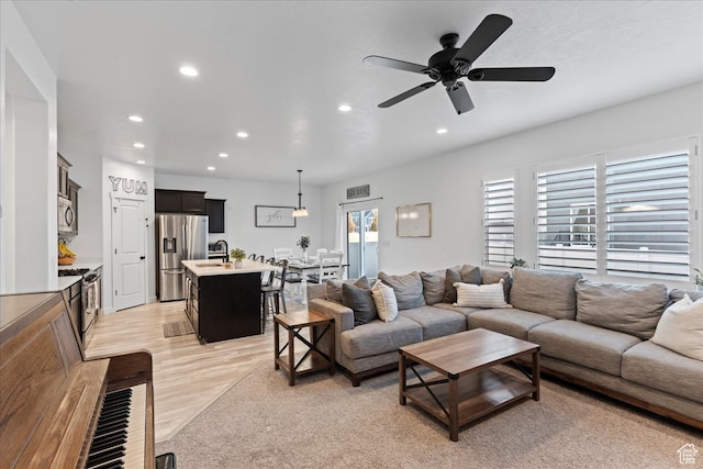 513 S Valkyries Ln, Saratoga Springs, UT 84045 - living area featuring light wood-style floors, a ceiling fan, and recessed lighting