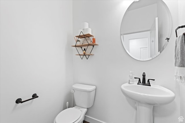 513 S Valkyries Ln, Saratoga Springs, UT 84045 - half bathroom featuring a sink, toilet, and baseboards