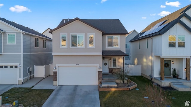 513 S Valkyries Ln, Saratoga Springs, UT 84045 - view of front of house featuring a garage, fence, stucco siding, driveway, and roof with shingles