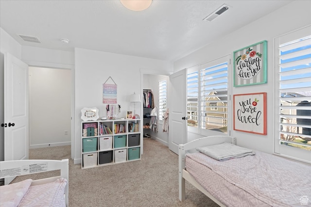 513 S Valkyries Ln, Saratoga Springs, UT 84045 - carpeted bedroom with a walk in closet, baseboards, and visible vents
