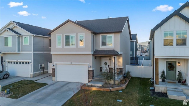 view of front of home with an attached garage, board and batten siding, driveway, and stucco siding