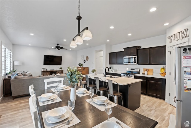 513 S Valkyries Ln, Saratoga Springs, UT 84045 - dining area featuring recessed lighting, light wood-style flooring, and a ceiling fan