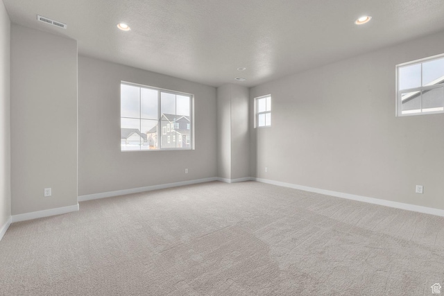 1839 S 2475 W, West Haven, UT 84401 - spare room featuring light carpet and a textured ceiling