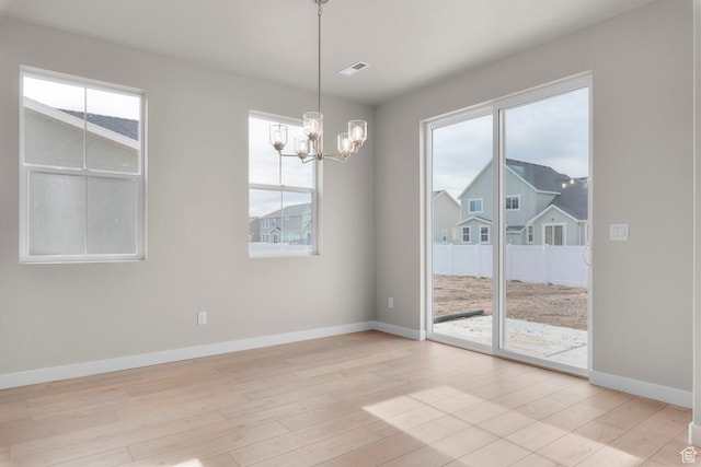 1839 S 2475 W, West Haven, UT 84401 - unfurnished dining area with light hardwood / wood-style floors and an inviting chandelier