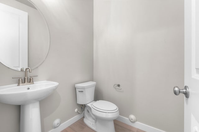 1839 S 2475 W, West Haven, UT 84401 - bathroom featuring hardwood / wood-style flooring, toilet, and sink