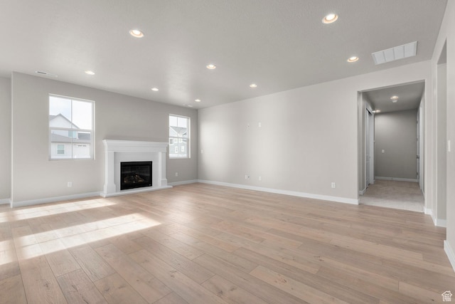 1839 S 2475 W, West Haven, UT 84401 - unfurnished living room featuring light hardwood / wood-style floors