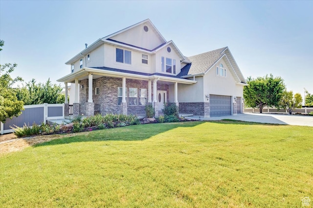 craftsman inspired home featuring brick siding, fence, a garage, driveway, and a front lawn