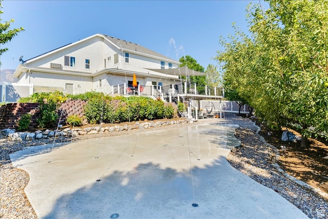 view of front of home featuring stairway and stucco siding
