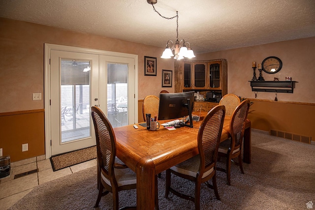 148 S Sunnybrook Dr, Salina, UT 84654 - dining space featuring a chandelier, a textured ceiling, french doors, and light tile patterned floors