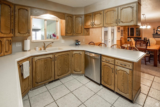 148 S Sunnybrook Dr, Salina, UT 84654 - kitchen featuring dishwasher, a textured ceiling, a peninsula, a chandelier, and brown cabinetry