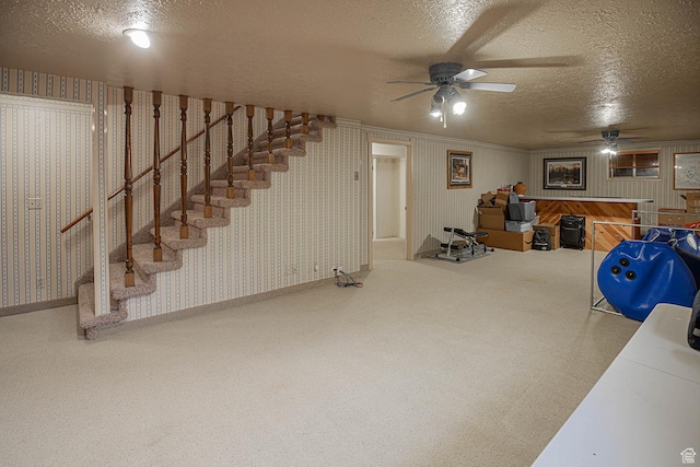 148 S Sunnybrook Dr, Salina, UT 84654 - below grade area with wallpapered walls, a ceiling fan, a textured ceiling, carpet, and stairway