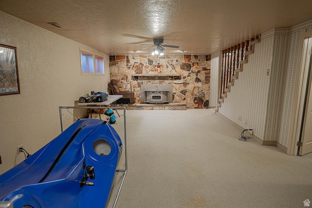 148 S Sunnybrook Dr, Salina, UT 84654 - rec room with a textured ceiling, ceiling fan, carpet, and a textured wall
