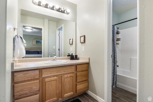 486 N 200 E, Santaquin, UT 84655 - bathroom with vanity, shower / bathtub combination with curtain, wood finished floors, a textured ceiling, and connected bathroom