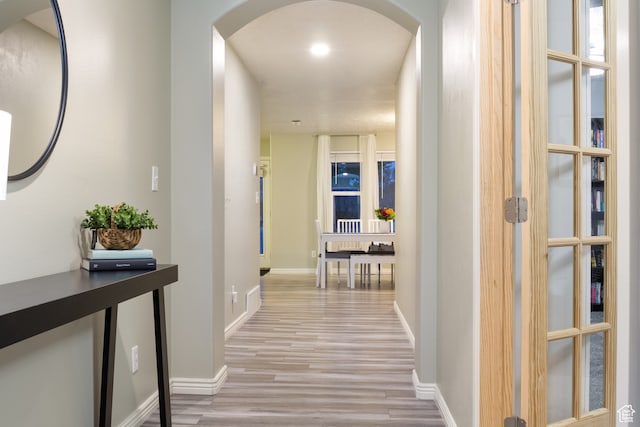 486 N 200 E, Santaquin, UT 84655 - corridor with arched walkways, light wood-style flooring, and baseboards