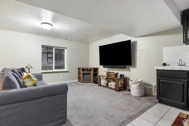 486 N 200 E, Santaquin, UT 84655 - living area featuring light colored carpet, a textured ceiling, light tile patterned flooring, and baseboards