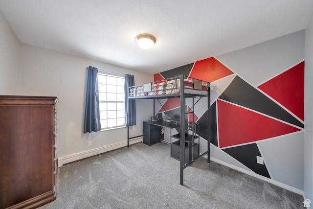 carpeted bedroom featuring a baseboard heating unit