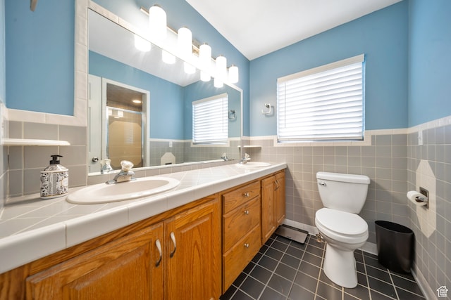 bathroom featuring tile patterned floors, an enclosed shower, tile walls, and toilet