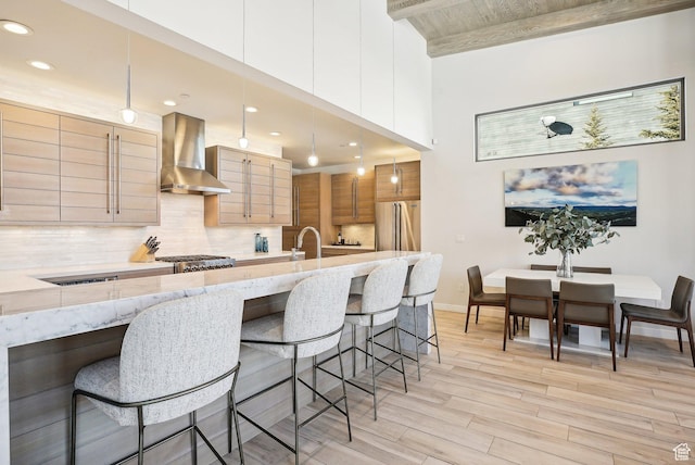 6412 Golden Bear Loop W, Park City, UT 84098 - kitchen featuring wall chimney range hood, light wood finished floors, decorative backsplash, high end fridge, and recessed lighting