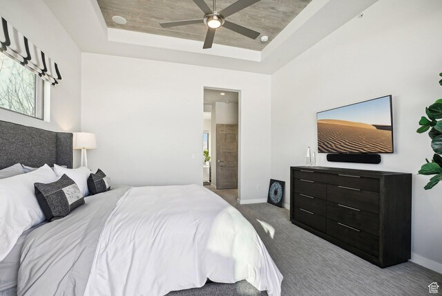6412 Golden Bear Loop W, Park City, UT 84098 - carpeted bedroom with a tray ceiling, baseboards, and multiple windows