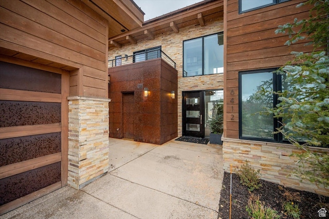 6412 Golden Bear Loop W, Park City, UT 84098 - doorway to property featuring stone siding and a patio area