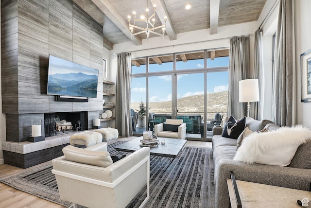 6412 Golden Bear Loop W, Park City, UT 84098 - living area featuring a chandelier, wood finished floors, beam ceiling, and a premium fireplace