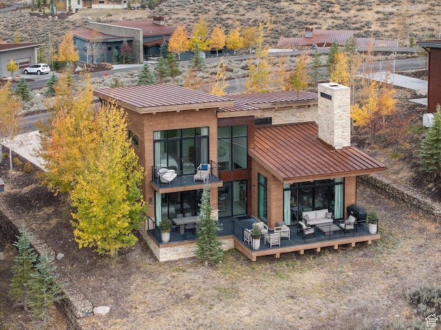 6412 Golden Bear Loop W, Park City, UT 84098 - rear view of property with outdoor lounge area, a standing seam roof, a chimney, a deck, and metal roof