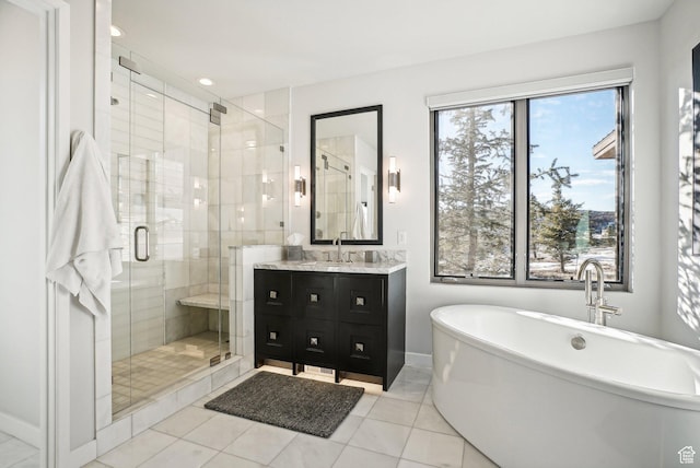 6412 Golden Bear Loop W, Park City, UT 84098 - bathroom with a freestanding bath, vanity, a stall shower, baseboards, and tile patterned flooring