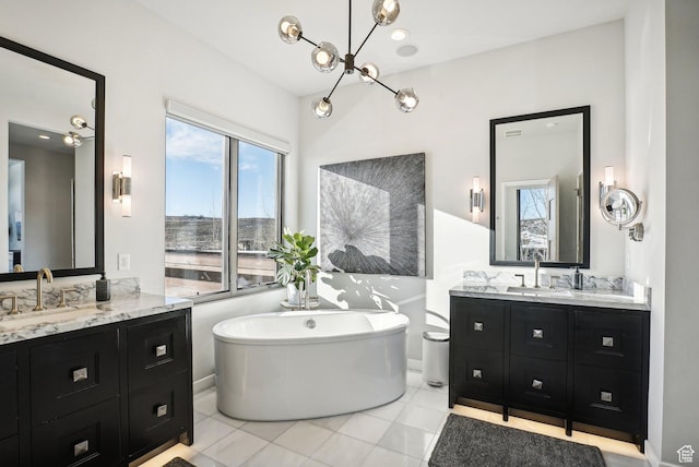 6412 Golden Bear Loop W, Park City, UT 84098 - bathroom with healthy amount of natural light, a soaking tub, two vanities, and tile patterned flooring