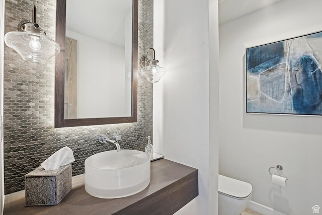 6412 Golden Bear Loop W, Park City, UT 84098 - bathroom featuring decorative backsplash, toilet, and vanity