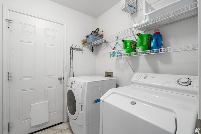laundry area with independent washer and dryer