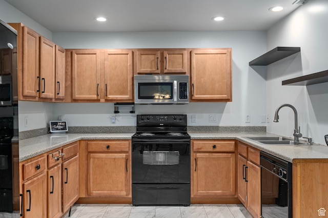 kitchen with black appliances and sink